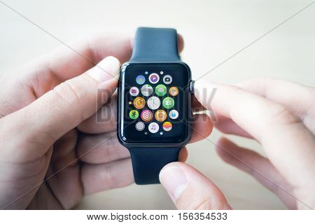 Black smart watches in the hands of