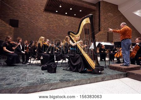 ROMEOVILLE, ILLINOIS / UNITED STATES - OCTOBER 26, 2016: Dr. Lawrence Sisk conducts the Metropolitan Youth Symphony Orchestra during a rehearsal prior to a concert at Lewis University.