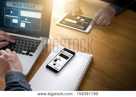 Web Design Template And  Web Page Closeup Shot Of Laptop With Digitaltablet And Smartphone On Desk.