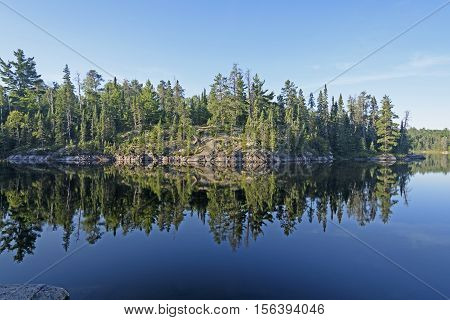 Morning Reflections in Canoe Country on Sidney Lake of Quetico Provincial Park in Ontario