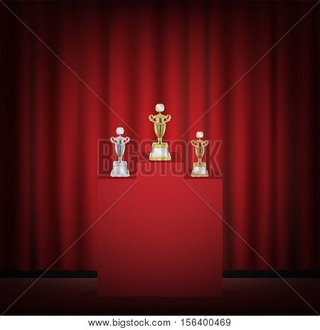 Gold silver bronze trophy on a stage with red curtain backgrond