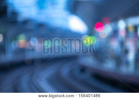 ฺBlurry image of high-speed bullet train station in evening