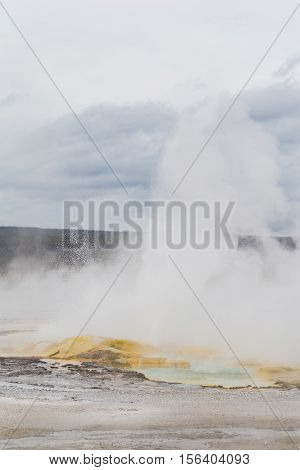 The Clepsydra Geyser erupts in Yellowstone National Park.