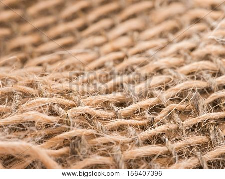 Skein of jute twine on sacking. Clew of natural rope. Close up