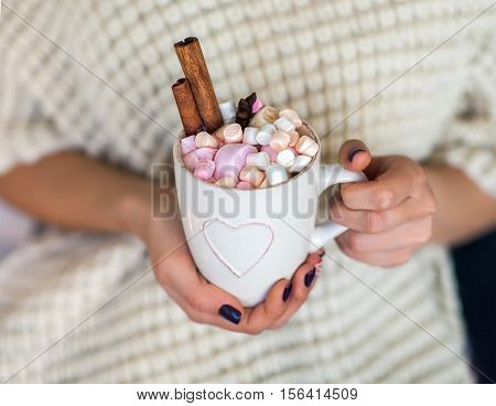Woman Hands Holding A Cup Of Hot Chocolate With Marshmallows