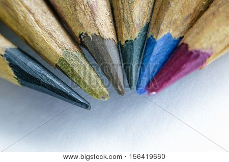 Colored pencils sharpened by hand closeup. Selective focus