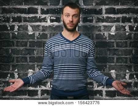 Portrait Young Man Shrugging Shoulders