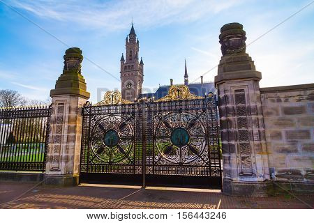Gate of international law administrative building Peace Palace at Hague, Netherlands at sunset