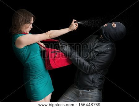 Self Defense Concept. Young Couple Is Defending With Pepper Spra