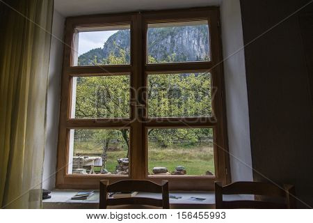Window view from an old house in Theth National Park, Albania