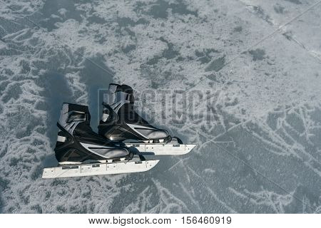 Tourists travel to Norway hiking ice skating on the frozen lake. Special long skate for long distances. Mounting under the ski boots. Location of Lake Baikal action. The Russian called Bayes or Loft.