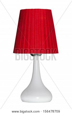 Red modern table lamp isolated on white background. Bedside night lamp