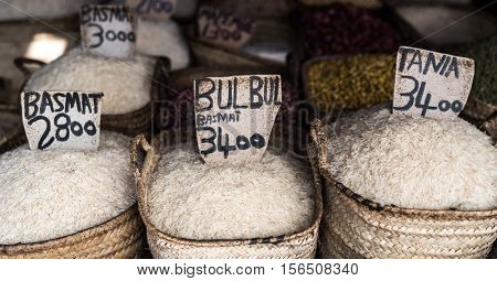 different rice kinds sale in full sacks at Zanzibar market street, Africa