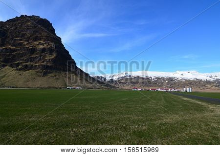 Lush landscape surrounding Stratovolcano which erupted in Iceland.