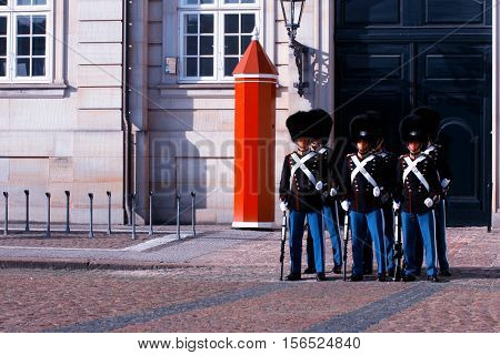 Royal Guards during the ceremony of changing the guards on the square at Amalienborg Castle Copenhagen Denmark