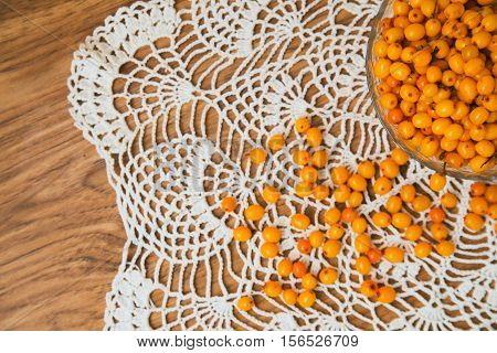 buckthorn on a handful of therapeutic knitted napkin