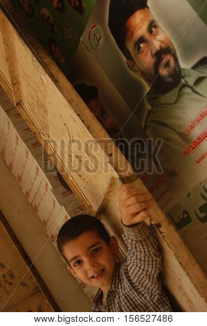BEIRUT, LEBANON-AUGUST 2:Unidentified Palestinian children make victory sign in Shatila refugee camp on August 2, 2006 in Beirut,Lebanon.