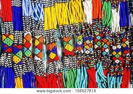 African tribal necklaces. Closeup of intricate bead work for sale at a street market. 