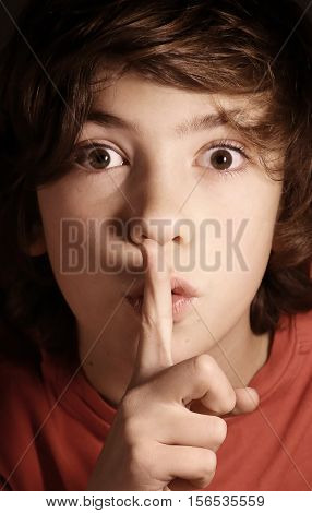 silence gesture boy ask for keep important secret from others mystery