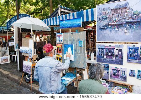 PARIS FRANCE, circa April 2016. Place du tertre in Montmartre. Close to the cathedral of the sacre coeur. The square du tertre is a meeting place of artists very visited by the tourists to take portraits in the moment