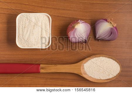 Cooking Brazilian Farofa. Manioc Flour. Farinha de Mandioca over a wooden table