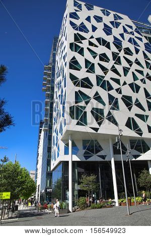 OSLO NORWAY - AUGUST 17 2016: Exterior of a new apartment blocks 'Barcode buildings' and walkway on Dronning Eufemias gate street in Oslo Norway on August 17 2016.