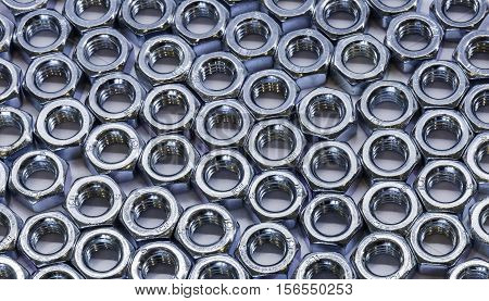Some bolts and nuts on white background