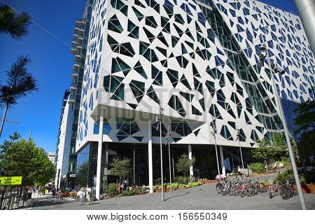 OSLO NORWAY - AUGUST 17 2016: Exterior of a new apartment blocks 'Barcode buildings' and walkway on Dronning Eufemias gate street in Oslo Norway on August 17 2016.