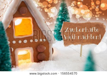 Gingerbread House In Snowy Scenery As Christmas Decoration. Christmas Trees And Candlelight. Bronze And Orange Background With Bokeh Effect. German Text Zauberhafte Weihnachten Means Magic Christmas