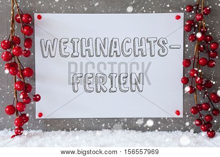 Label With German Text Weihnachtsferien Means Christmas Break. Red Christmas Decoration On Snow. Urban And Modern Cement Wall As Background With Snowflakes.