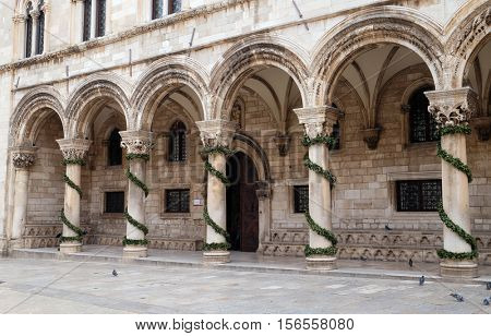 DUBROVNIK, CROATIA - DECEMBER 01: Columns and exterior of the Duke's Palace (Knezev dvor) decorated with Advent wreaths in Dubrovnik, Croatia on December 01, 2015.