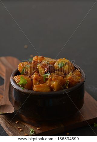 Indian style sweet and sour yellow pumpkin curry