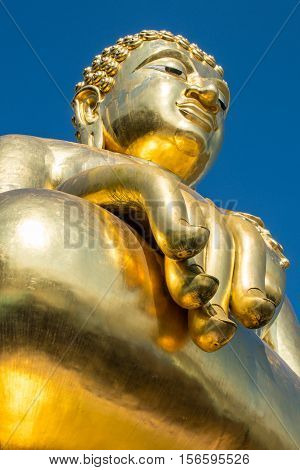 The golden Buddha in Chiang Saen style located at the Golden triangle near Mekong river the border between Thailand - Myanmar and Laos.
