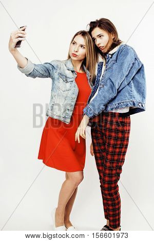 best friends teenage girls together having fun, posing emotional on white background, besties happy smiling, lifestyle people concept close up