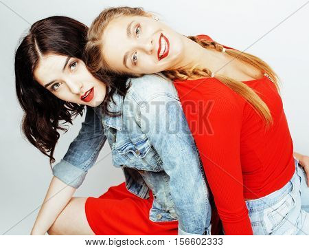best friends teenage girls together having fun, posing emotional on white background, besties happy smiling, lifestyle people concept close up