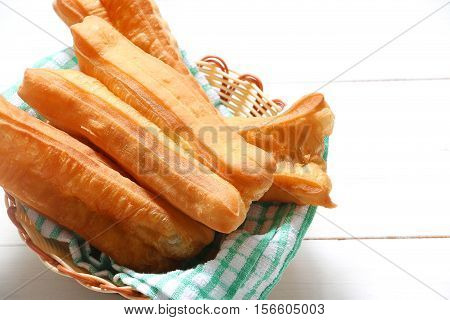 Chinese traditional Fried bread stick or popular known as You Tiao normally eaten with rice porridge or spread with butter and coconut jam