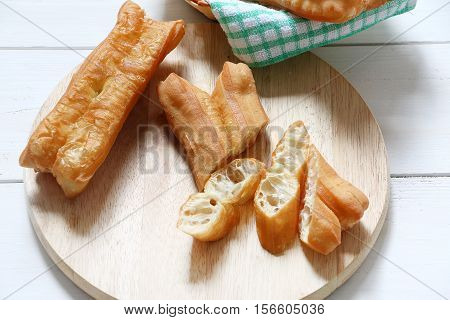 Chinese traditional Fried bread stick or popular known as You Tiao normally eaten with rice porridge or spread with butter and coconut jam