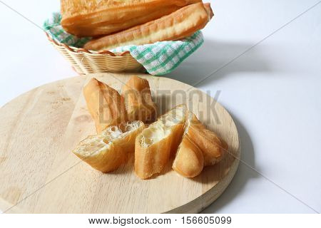 Chinese traditional Fried bread stick or popular known as You Tiao normally eaten with rice porridge or spread with butter and coconut jam
