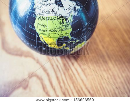 World Globe Map close up United state of America Wooden background Education resouce