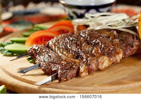 Breast of Lamb Skewers Garnished with Vegetable and Potato