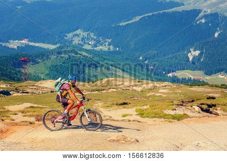 Bucegi Mountains, Romania July 09, 2015: Unidentified Biker Climbs The Hill In Bucegi Mountains In R