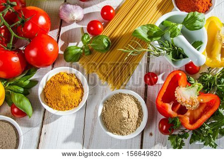 Preparation for cooking spaghetti on old wooden table