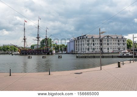 Amsterdam Netherlands - August 1 2016: The National Maritime Museum and old ship in Amsterdam a cloudy day