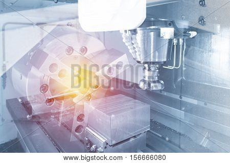 Abstract scene of the face milling tool with the raw material work piece on the CNC milling machine and lighting effect.