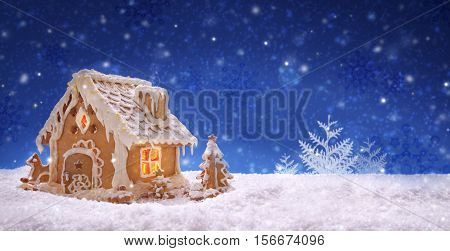 Gingerbread house isolated on blue sky background.Christmas card.
