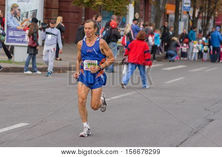 DNEPR UKRAINE - SEPTEMBER 25, 2016:Senior participant hurrying to finish line during 