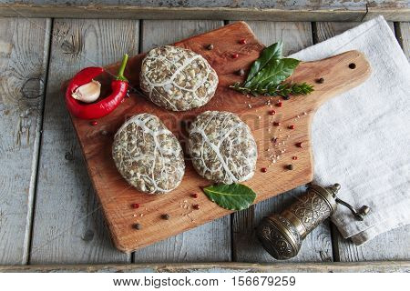 Caul-Fat Meatballs raw burger cutlet handmade on desk