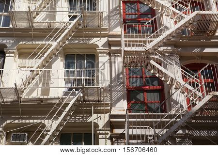 The typical old houses with fire stairs in New York