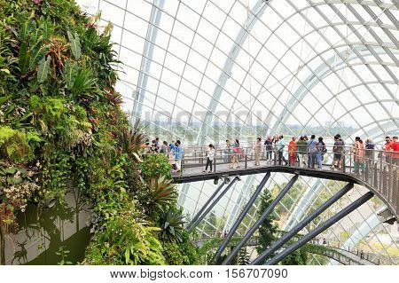 Singapore, Republic of Singapore - May 5, 2016: tourists exploring Cloud Garden conservatory greenhouse