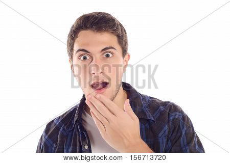 Portrait of a young amazed man. Isolated white background.
